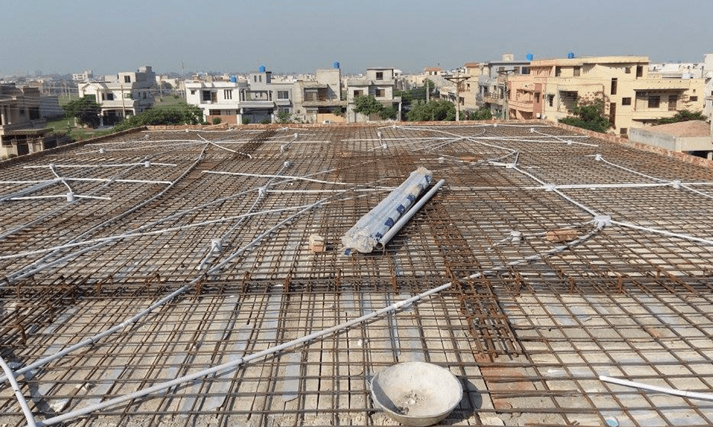 Steel reinforcement and conduit layout before slab pouring, Mughal Sons project